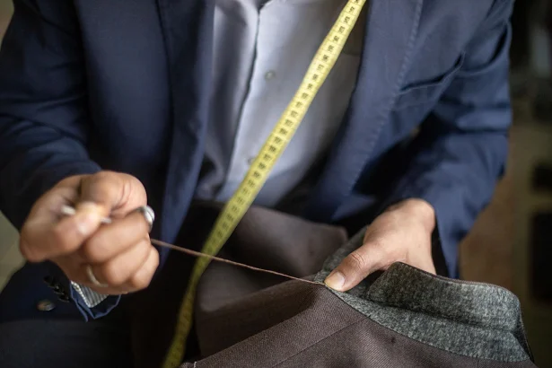 Close-up alteration detail with stitching and pins